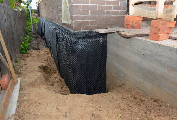 SJ Waterproofing Pros technician performing targeted Emergency Waterproofing assessment in Jordan, NY